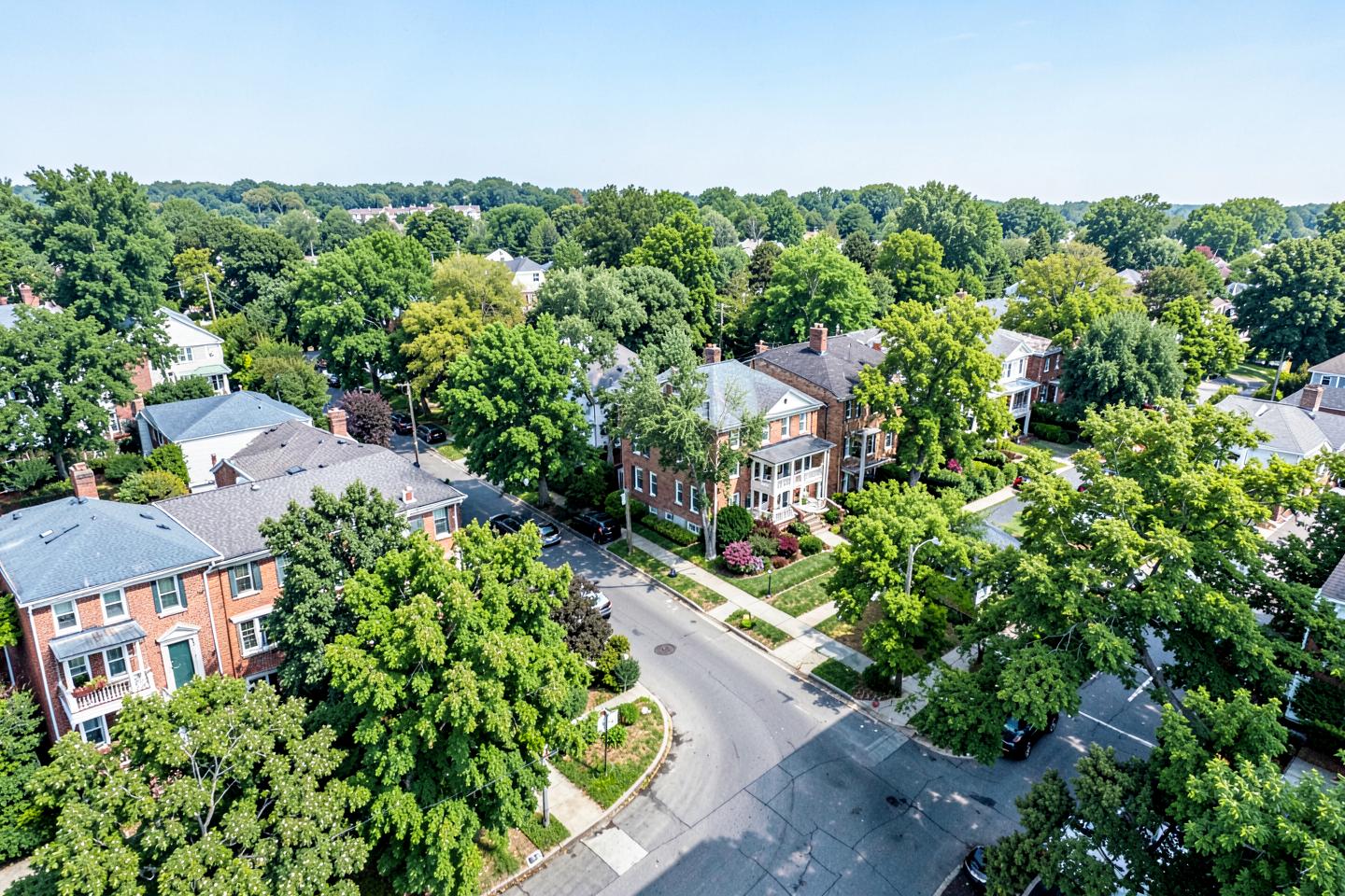 Tree-lined residential streets with brick homes in a Richmond, Virginia neighborhood